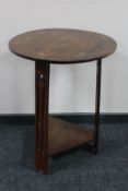 A circular oak Arts & Crafts occasional table