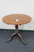 A Victorian mahogany pedestal tilt top table