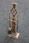 An Art Nouveau companion set on stand
