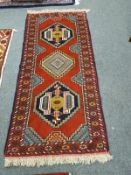 A Caucasian runner on red ground 192 cm x 85 cm