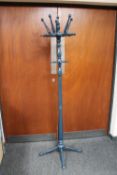 A painted hat and coat stand