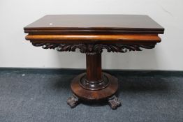 A Victorian mahogany pedestal turnover top tea table