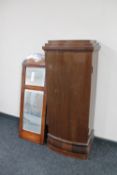 A continental mahogany sentry door cabinet together with a mahogany hall mirror