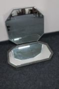 An early 20th century octagonal frameless mirror together with an Arts & Crafts octagonal mirror