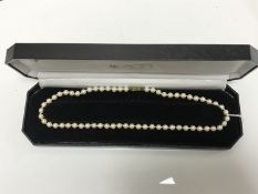 A Lotus 'Pearl' necklace on 9ct yellow gold clasp