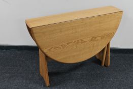 An Ercol elm gateleg table