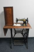A Singer treadle sewing machine in mahogany table