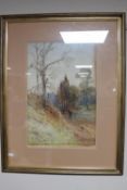 An Edwardian gilt framed watercolour, figure on a country path, signed M.