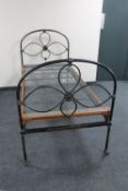 A Victorian cast iron 3' bed frame with box spring