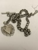A silver Albert chain with T-bar and silver token, length 42cm CONDITION REPORT: 53.