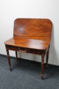 A Victorian mahogany turnover top tea table