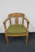 A blonde oak armchair