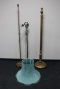A painted gilt standard lamp with shade together with an antique brass floor lamp and an adjustable