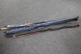 Six assorted fishing rods to include a Storm pink spinning rod,