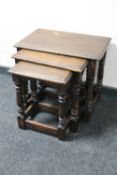 A nest of three oak tables