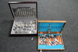 Two canteens containing stainless steel cutlery