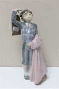 A Lladro figure of a matador boy with cape