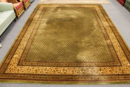 A machine made Keshan carpet on green ground,