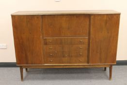 A mid twentieth century continental walnut sideboard