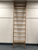 A pine wall mounted clothes hanger