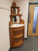 An inlaid satinwood bow fronted cabinet,