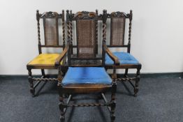 A set of four antique oak barley twist bergere back dining chairs