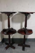 Four circular pedestal bar tables