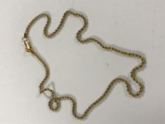A yellow metal rope twist chain, marked 'Swarovski', 8.6g.