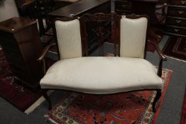 An Edwardian inlaid mahogany salon settee,
