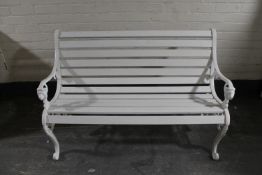 A cast iron wooden slatted garden bench