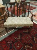 A 19th century mahogany settle,