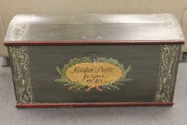 An antique hand painted dome topped shipping trunk