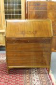 A mid twentieth century continental walnut writing bureau