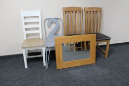 A pair of contemporary oak leather seated dining chairs together with a ladder backed chair,