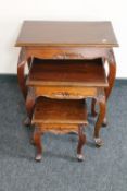 A nest of three Eastern mahogany tables