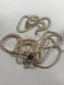 An Art Deco style faux pearl necklace together with one other.
