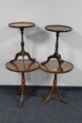 A pair of mahogany pie crust edge wine tables together with two further mahogany leather topped