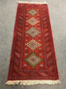 A Caucasian runner on red ground,