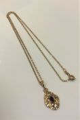 A 9ct gold diamond and amethyst set pendant on 9ct gold chain, 3.7g.