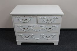 An early 20th century painted pine four drawer chest