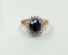 An 18ct gold diamond and sapphire cluster ring,