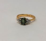 A demantoid garnet and diamond ring, size R CONDITION REPORT: 5.