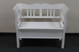 A contemporary painted storage settle