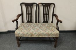 A 19th century mahogany settle,