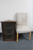 A mahogany glazed door hanging corner cabinet together with a contemporary dining chair