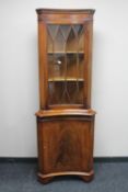 An inlaid mahogany convex display cabinet