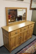 A good quality oak three door sideboard, width 137 cm,