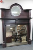An Edwardian mahogany mirror backed fire surround