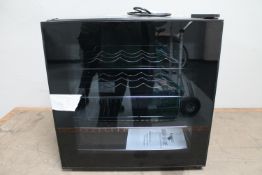 A bench top glass door wine chiller