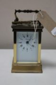 A French brass cased Angelus carriage clock with key